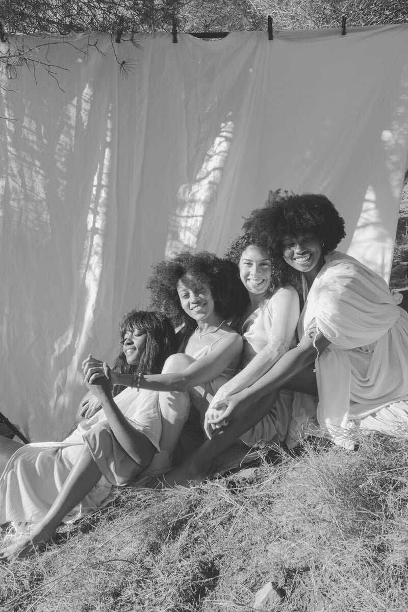 Women Posing with White Cloth in the Nature